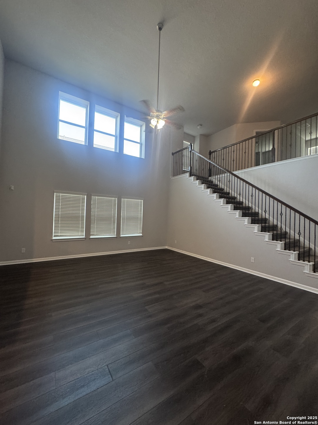 473 Hunters Ranch East San Antonio, TX 78253 - Photo 2 of 11 a view of an empty room with wooden floor and a window