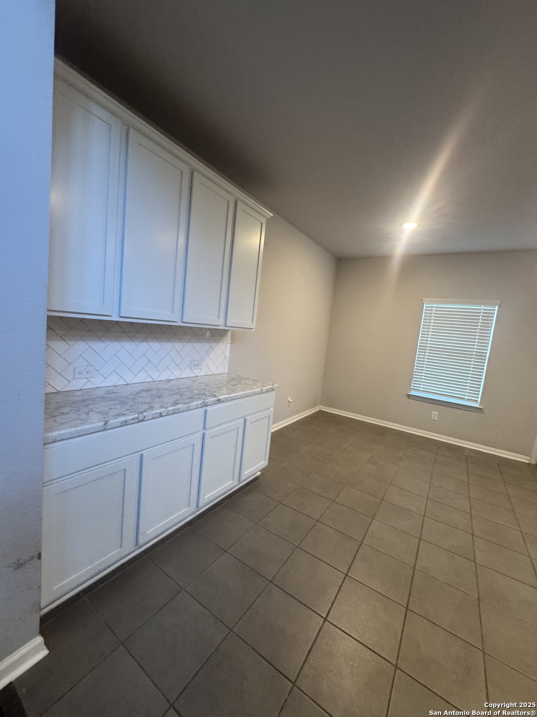 473 Hunters Ranch East San Antonio, TX 78253 - Photo 4 of 11 a kitchen with cabinets and window