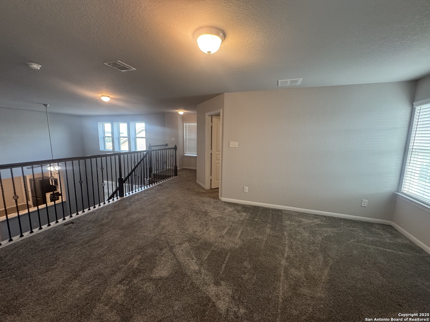 473 Hunters Ranch East San Antonio, TX 78253 - Photo 8 of 11 an empty room with wooden floor