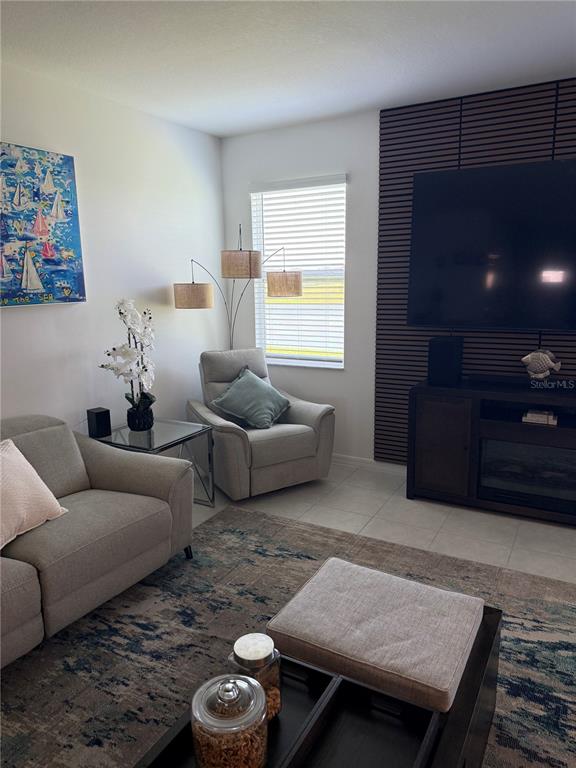9276 Bonita Mar Drive Parrish, FL 34219 - Photo 15 of 54 a living room with furniture and a flat screen tv