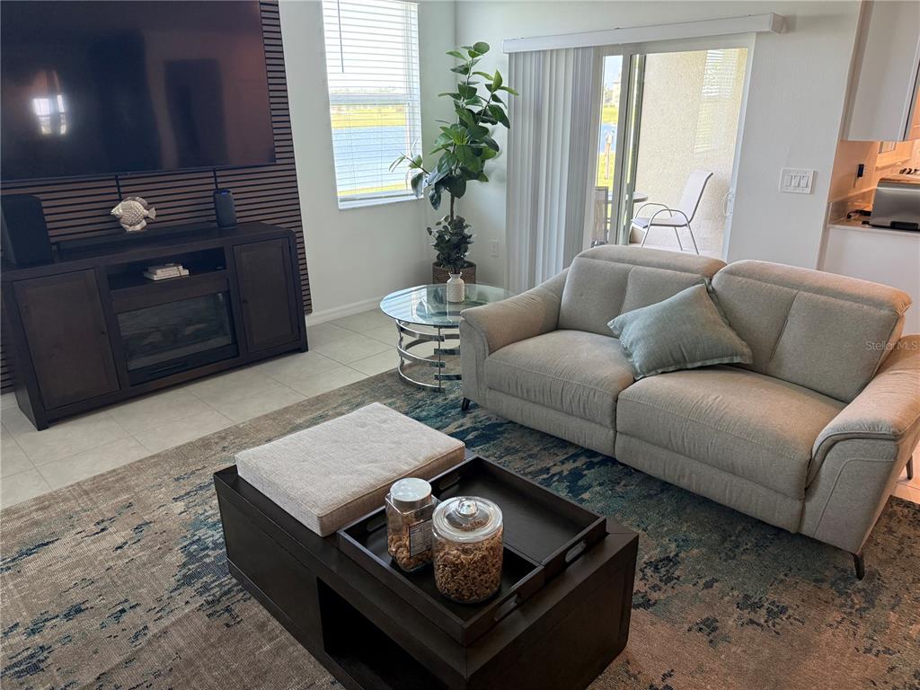9276 Bonita Mar Drive Parrish, FL 34219 - Photo 16 of 54 a living room with furniture and a fireplace