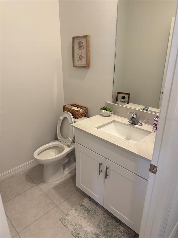 9276 Bonita Mar Drive Parrish, FL 34219 - Photo 19 of 54 a bathroom with a toilet sink and mirror