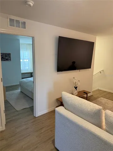 a bedroom with bed and window