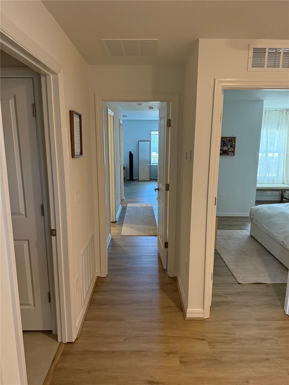 9276 Bonita Mar Drive Parrish, FL 34219 - Photo 27 of 54 a view of a hallway with wooden floor