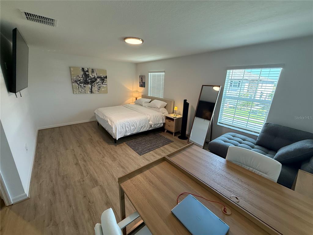 9276 Bonita Mar Drive Parrish, FL 34219 - Photo 31 of 54 a living room with furniture and a flat screen tv