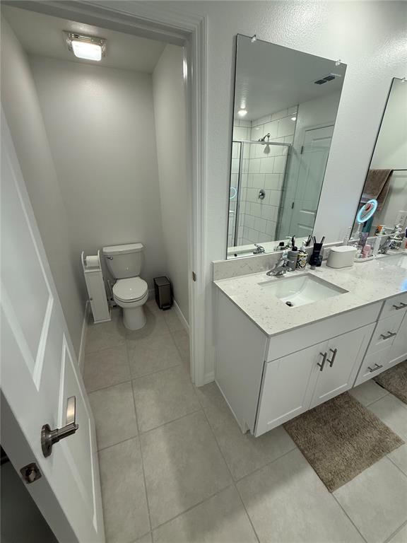 9276 Bonita Mar Drive Parrish, FL 34219 - Photo 34 of 54 a spacious bathroom with a double vanity sink toilet and mirror