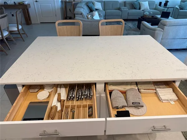 a living room with furniture rug and a table