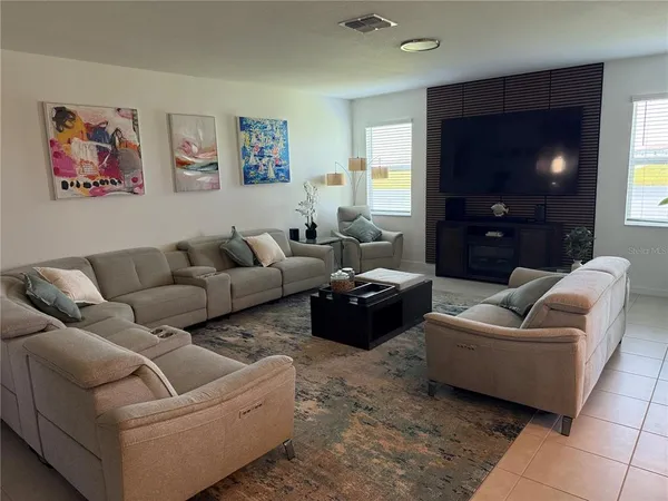 a bedroom with a bed and a lamp