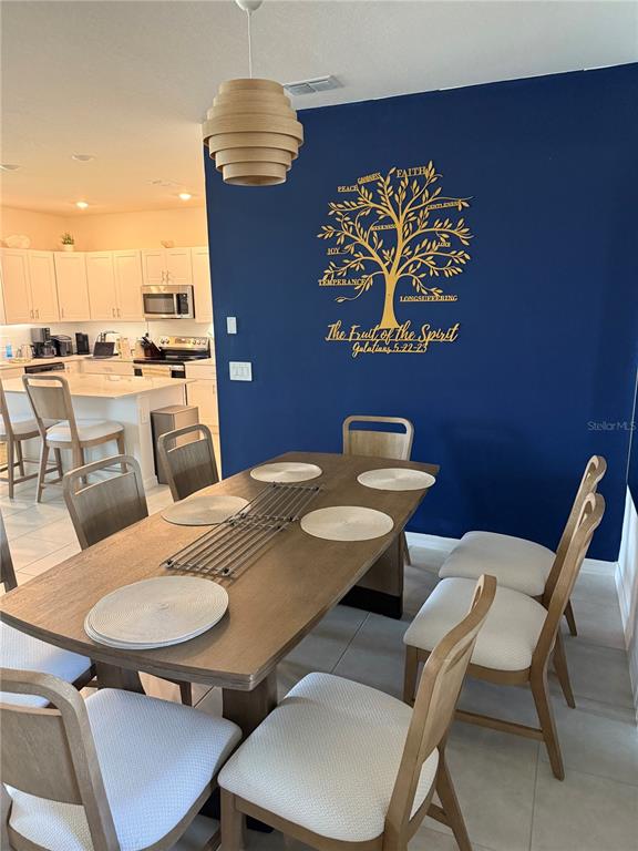 9276 Bonita Mar Drive Parrish, FL 34219 - Photo 42 of 54 a view of a dining room with furniture