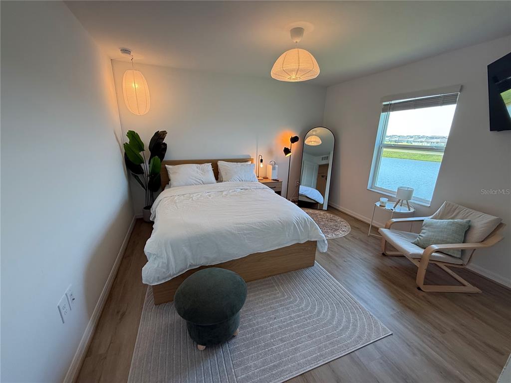 9276 Bonita Mar Drive Parrish, FL 34219 - Photo 45 of 54 a bedroom with a bed and a window