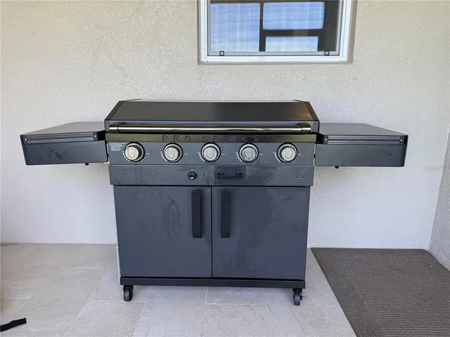 a stove top oven sitting inside of a kitchen