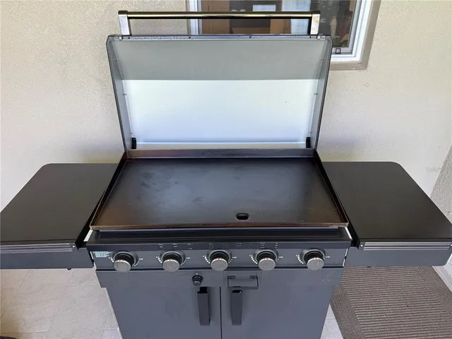 a kitchen with a sink and white cabinets