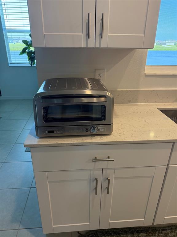 9276 Bonita Mar Drive Parrish, FL 34219 - Photo 50 of 54 a stove top oven sitting inside of a kitchen