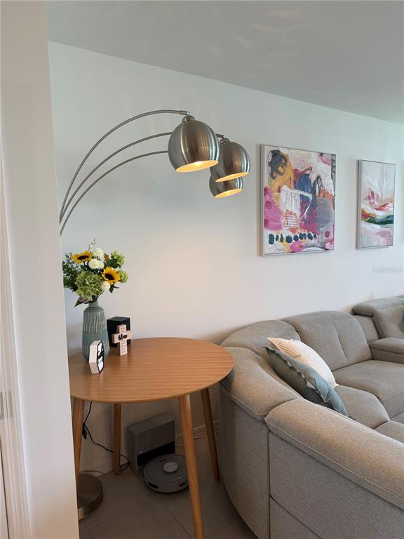 9276 Bonita Mar Drive Parrish, FL 34219 - Photo 8 of 54 a living room with furniture and flower pot