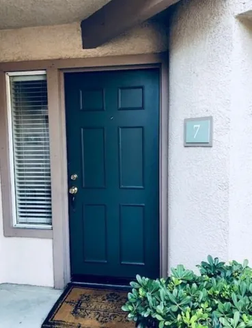 a view of swimming pool with a yard and a fountain