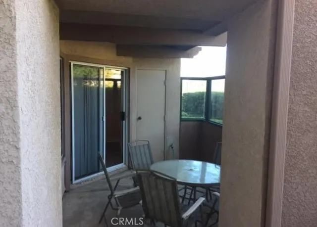 a room with a table and chairs