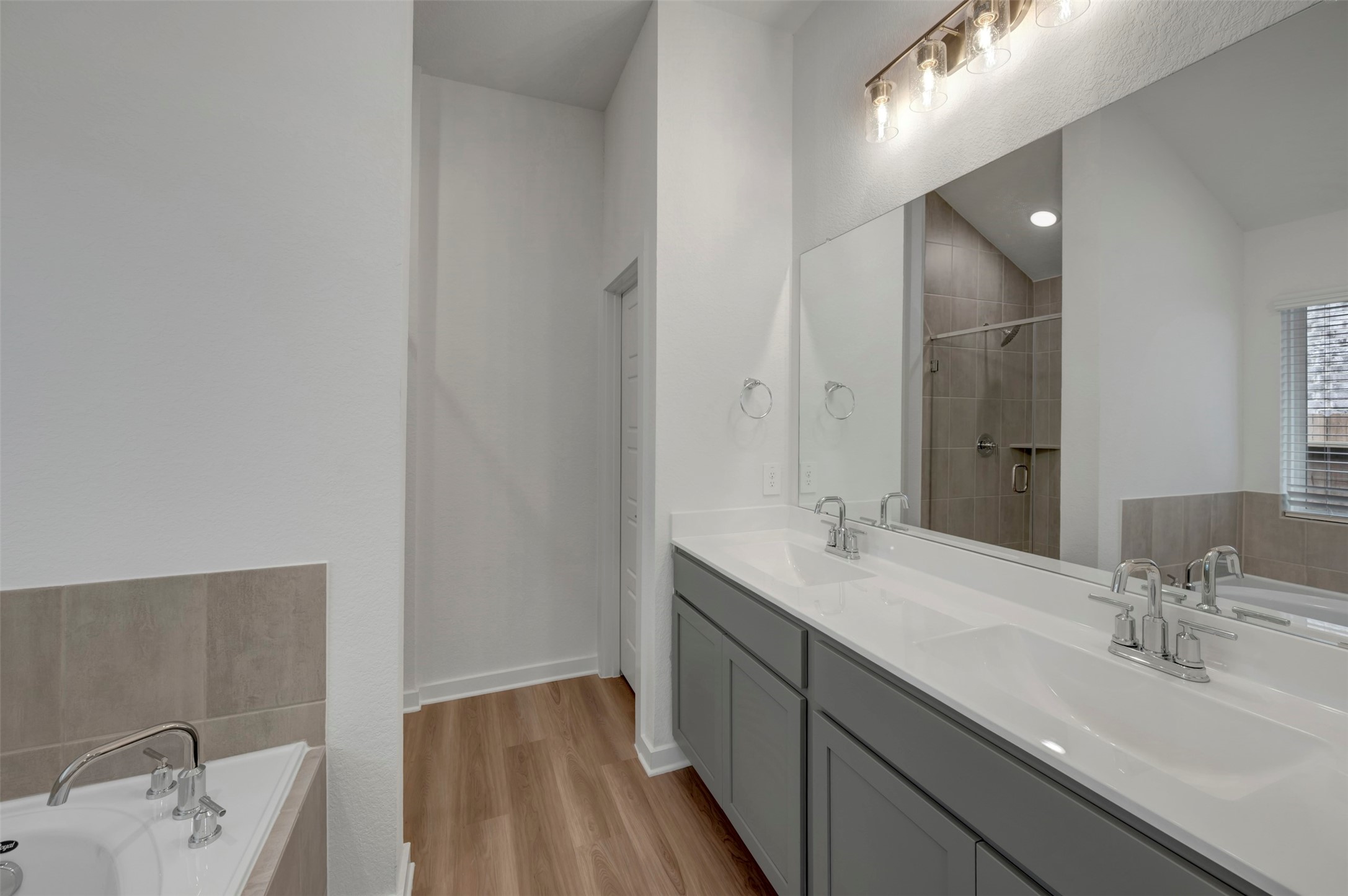 20534 Draper Road Tomball, TX 77377 - Photo 11 of 33 a bathroom with a sink and a mirror