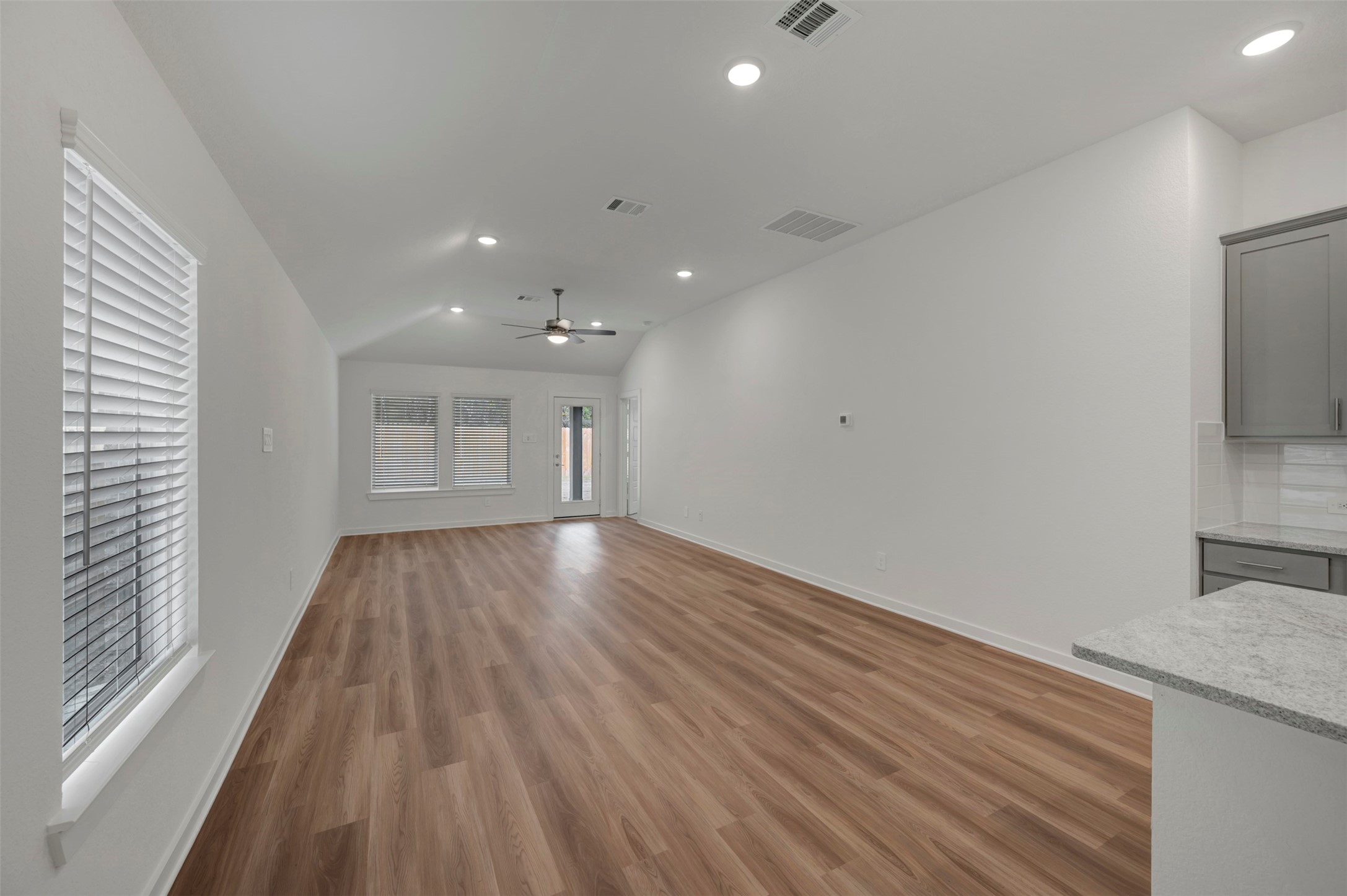 20534 Draper Road Tomball, TX 77377 - Photo 22 of 33 a view of a room with wooden floor and a window