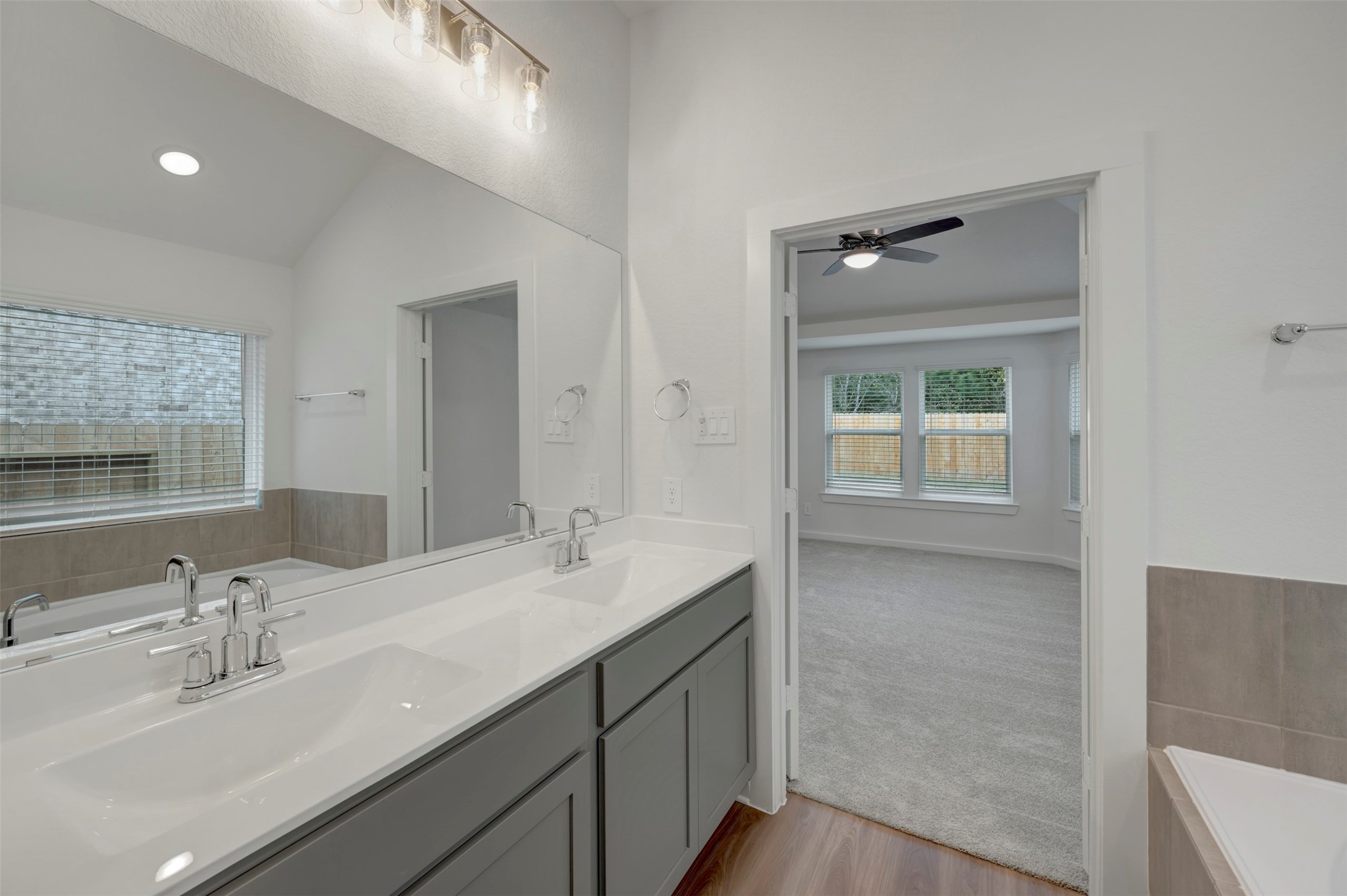 20534 Draper Road Tomball, TX 77377 - Photo 9 of 33 a bathroom with a sink double vanity and a mirror