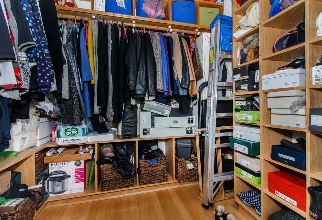 320 West 2nd Street, Unit 412 Boston, MA 02127 - Photo 14 of 16 a view of walk in closet with clothes and shoes