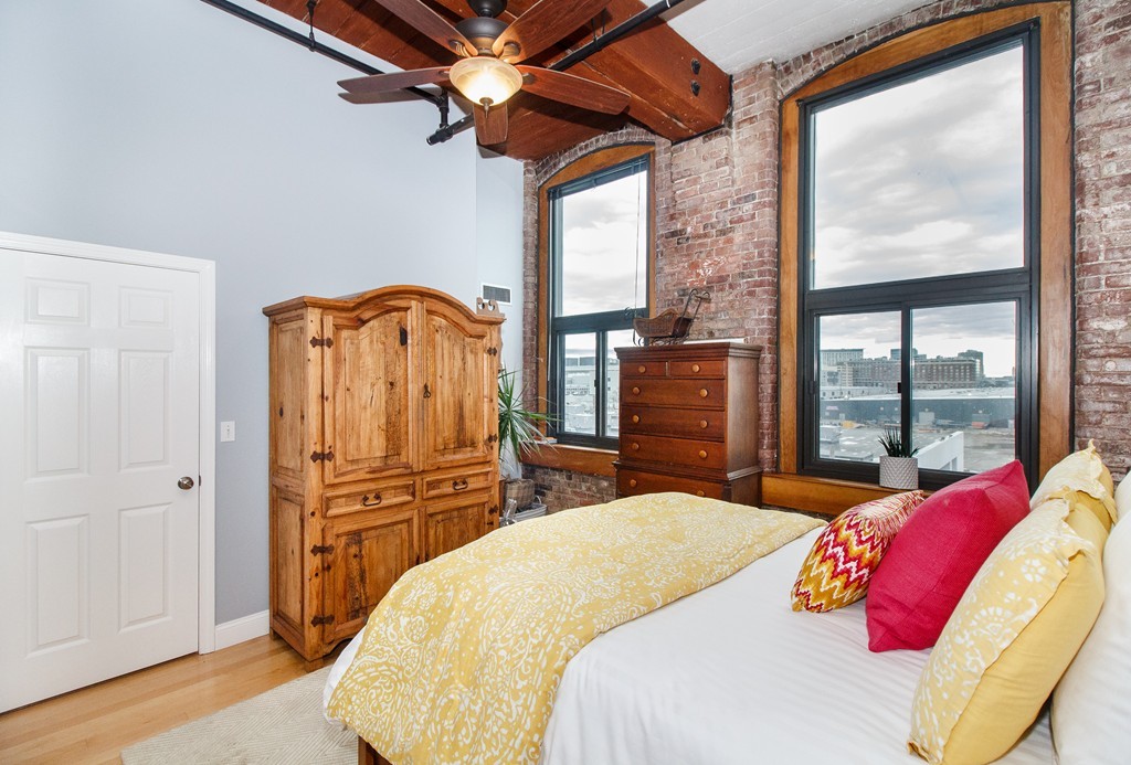 320 West 2nd Street, Unit 412 Boston, MA 02127 - Photo 4 of 16 a bedroom with a bed and a large window