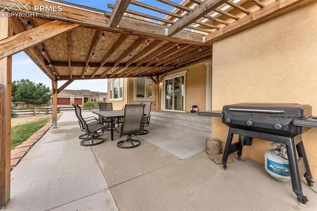 a view of a chairs and table in a patio