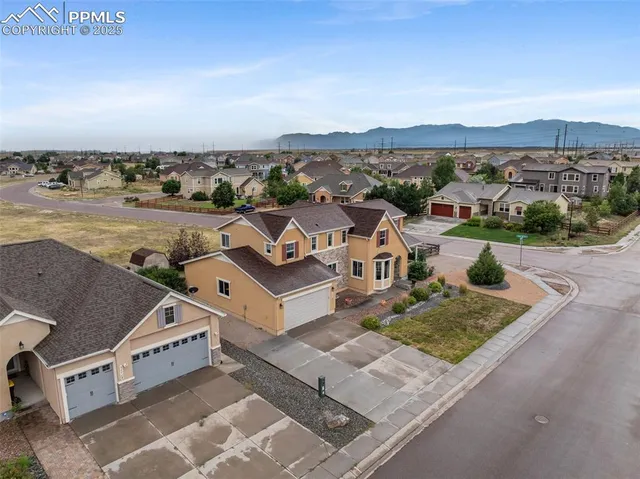 an aerial view of a house with a lake view