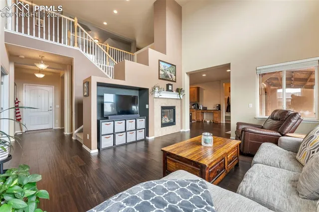 a living room with furniture and flat screen tv