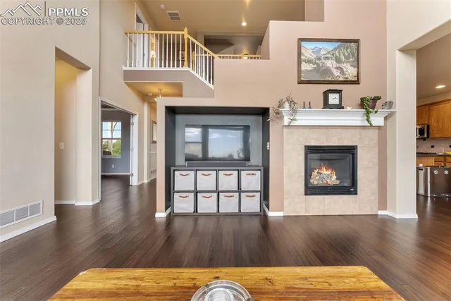 a view of a livingroom with furniture and a fireplace
