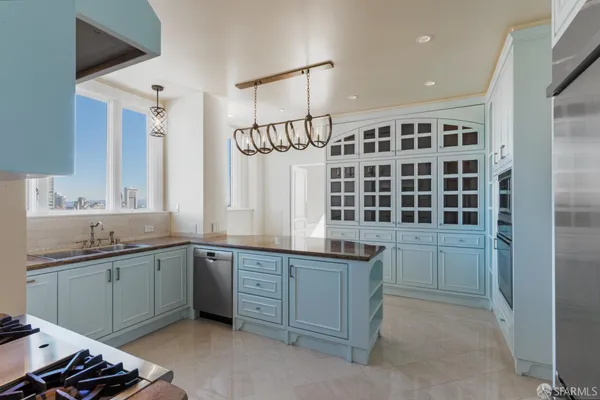 a kitchen with a sink stove and cabinets