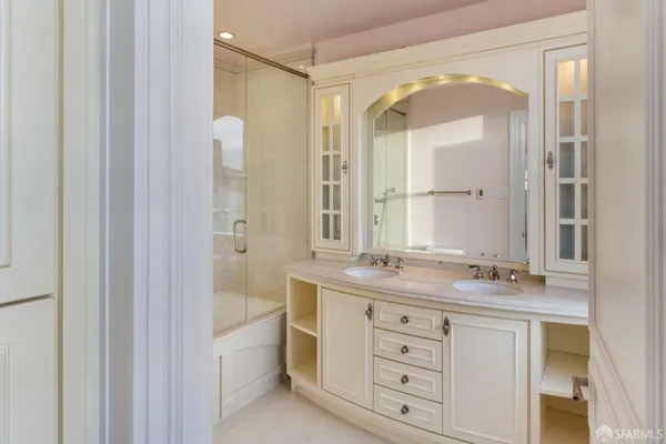 a bathroom with a granite countertop sink mirror and a