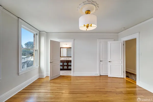 a view of kitchen and wooden floor