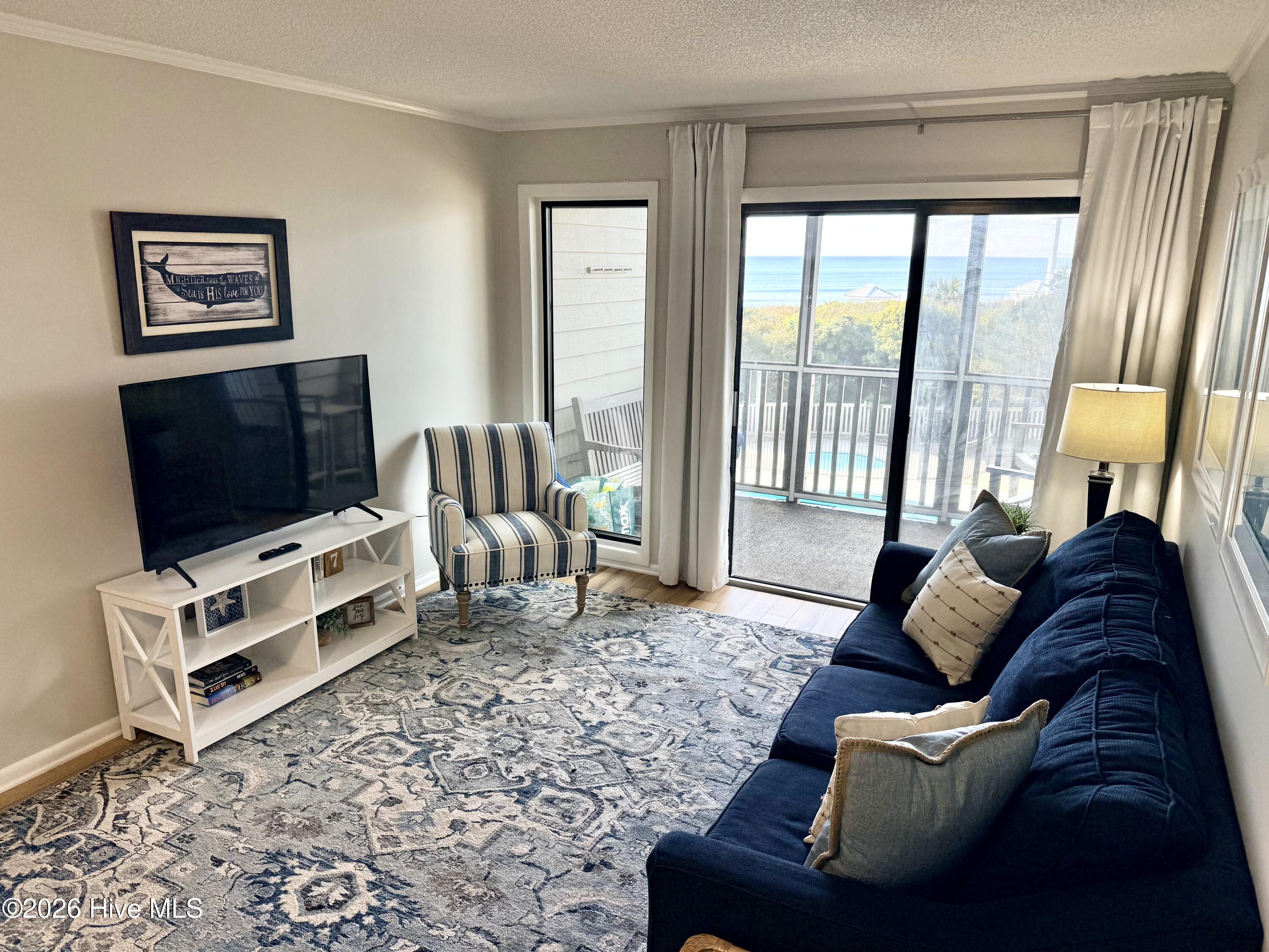 2511 West Fort Macon Road, Unit 211B Atlantic Beach, NC 28512 - Photo 4 of 38 Living Room & waterviews
