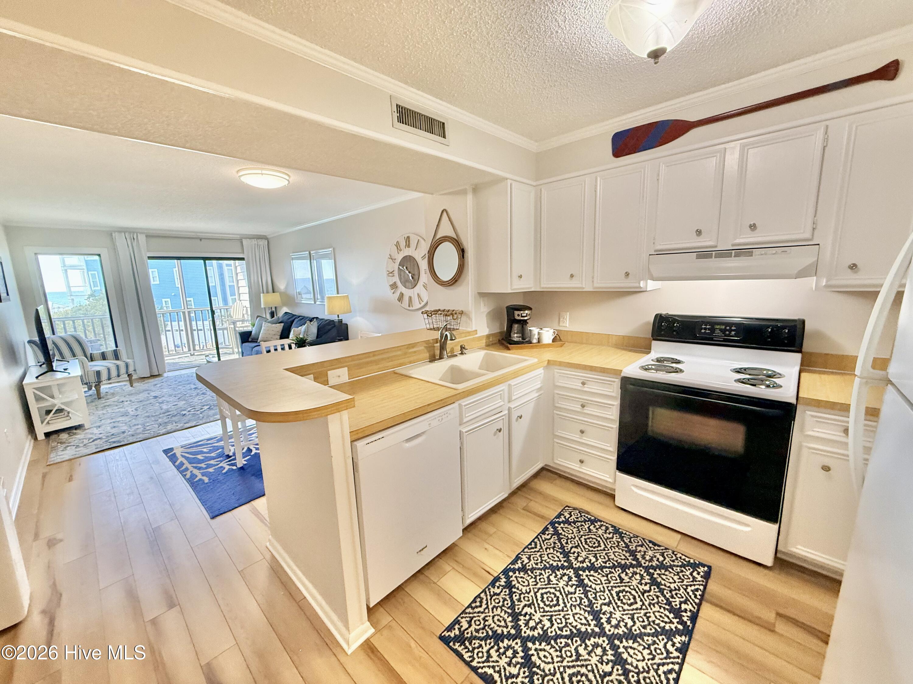 2511 West Fort Macon Road, Unit 211B Atlantic Beach, NC 28512 - Photo 7 of 38 Kitchen/Living Room