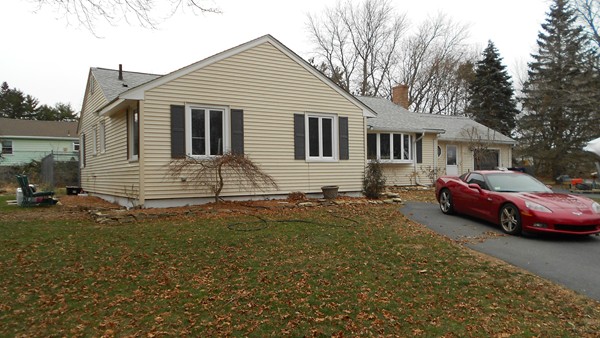 19 Leonard Road Sharon, MA 02067 - Photo 3 of 10 a front view of a house with a garden