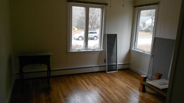 19 Leonard Road Sharon, MA 02067 - Photo 9 of 10 an empty room with wooden floor and windows