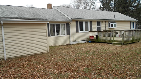 19 Leonard Road Sharon, MA 02067 - Photo 10 of 10 a view of a house with a yard and wooden fence