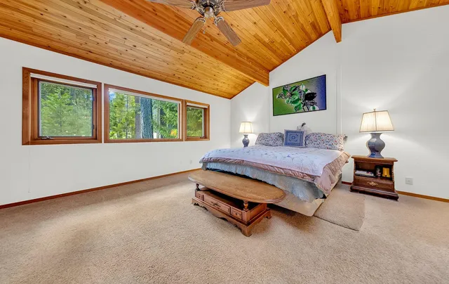 a bedroom with furniture and a window