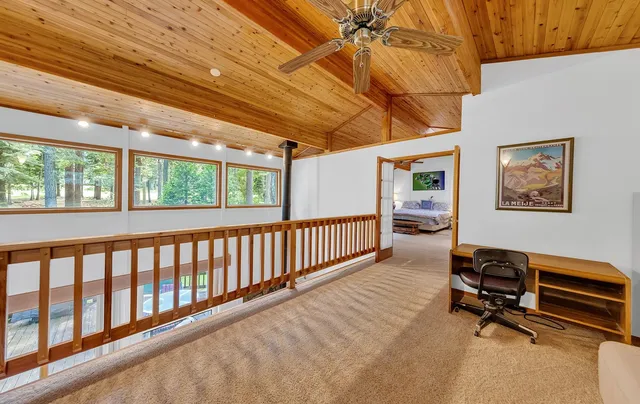 a bedroom with furniture and a window