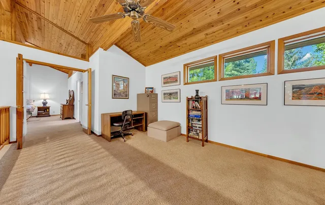a view of a livingroom with furniture and a flat screen tv