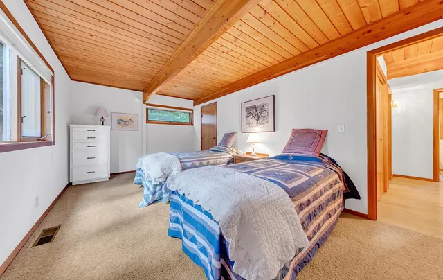 a bedroom with bed and window