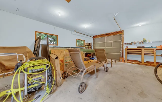a dining room with furniture and a flat screen tv
