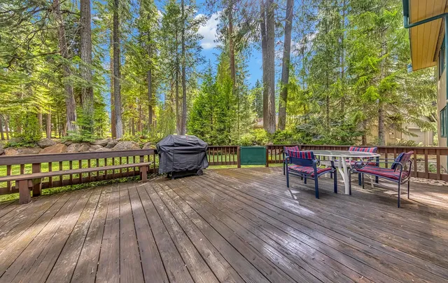 a view of outdoor sitting area with furniture and wooden floor