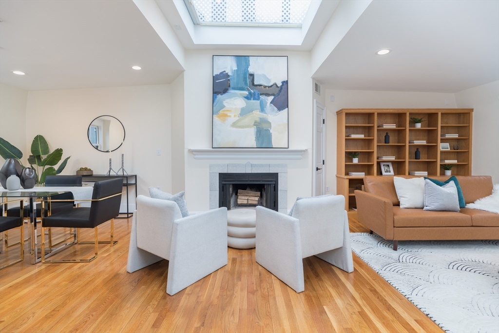 58 Gray Street, Unit 3 Boston, MA 02116 - Photo 1 of 21 a living room with furniture and a fireplace