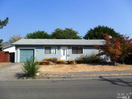 4545 Rinconada Drive Santa Rosa, CA 95409 - Photo 1 of 1 a front view of a house with a yard covered with trees