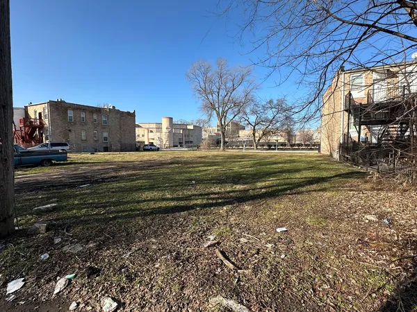 a view of houses with swimming pool