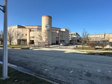 a view of road with card yard