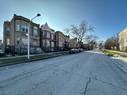 a view of yard with swimming pool and trees