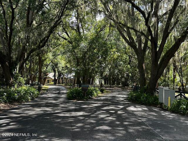 01 Southeast 159th Lane Umatilla, FL 32784 - Photo 14 of 40 a view of street with trees