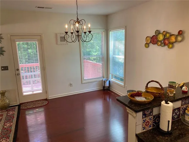 a kitchen with stainless steel appliances granite countertop a stove a refrigerator and a refrigerator